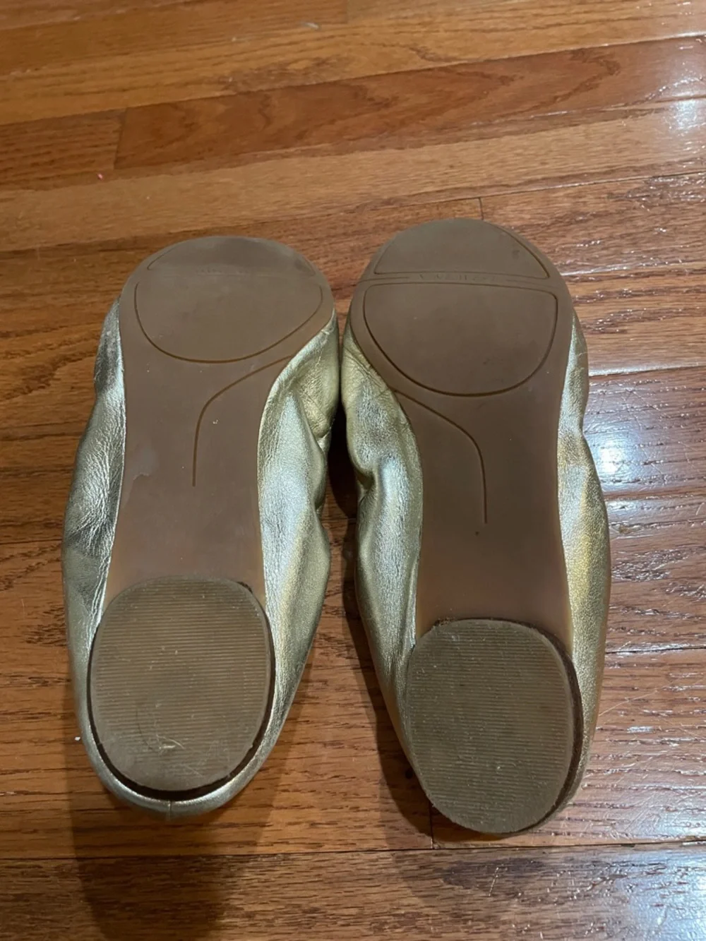 Nine West size 7-1/2 gold ballet flats with embellished rhinestones on toes.